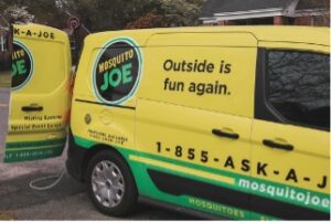 Mosquito Joe van with "outside is fun again" printed on side